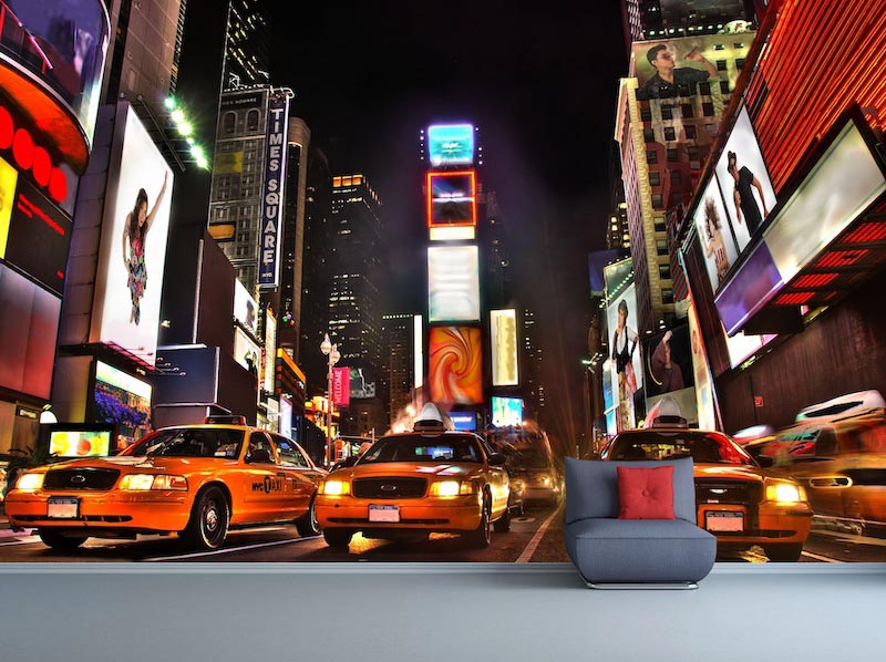 Times Square filled with illuminated signs and colourful city lights
