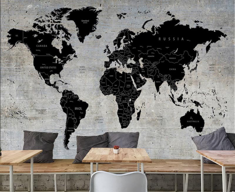 Detailed world map displayed on a grey concrete-textured background