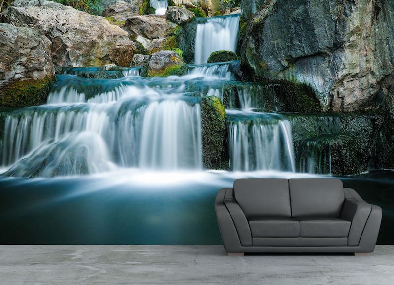 Flowing waterfall surrounded by layered natural rocks