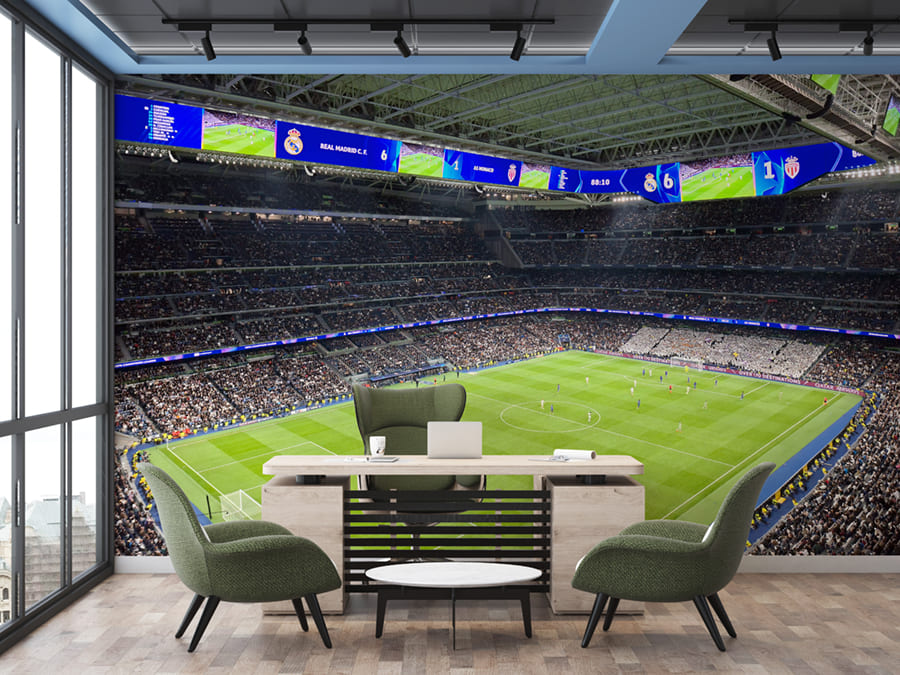 Interior view of Bernabeu Stadium with its green pitch and stands